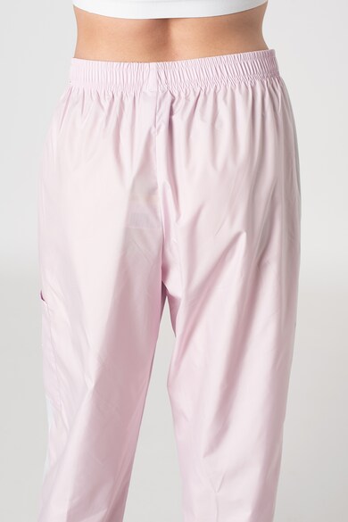Nike Pantaloni sport conici cu benzi laterale contrastante Femei
