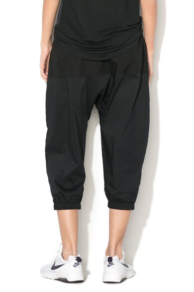 Nike Pantaloni sport capri cu buzunare laterale Femei