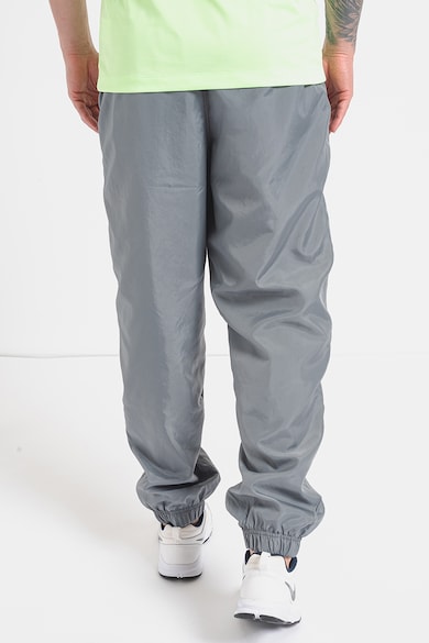 Nike Pantaloni de trening relaxed fit cu buzunare laterale Barbati