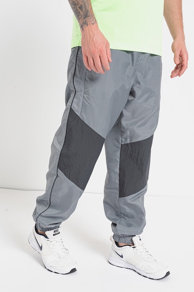 Nike Pantaloni de trening relaxed fit cu buzunare laterale Barbati