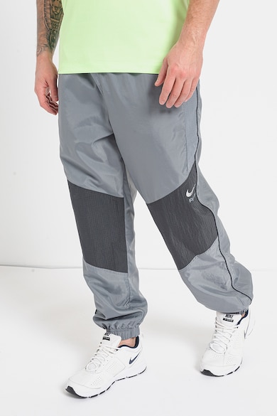 Nike Pantaloni de trening relaxed fit cu buzunare laterale Barbati