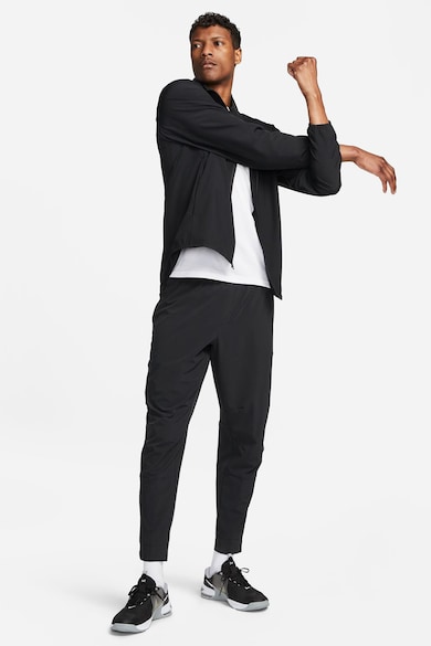 Nike Pantaloni conici cu tehnologie Dri-FIT si slituri cu fermoar Unlimited Barbati