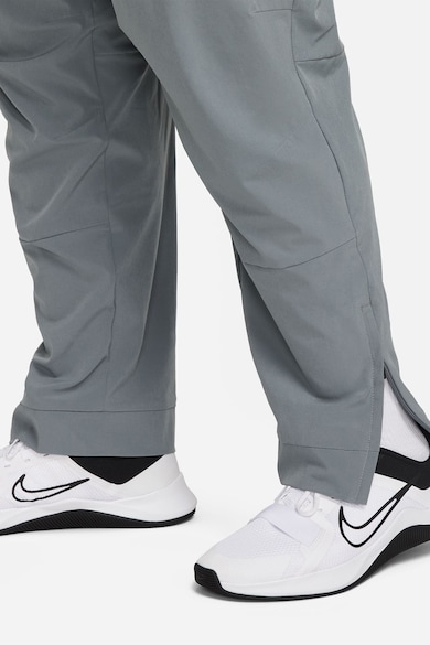 Nike Pantaloni conici cu tehnologie Dri-FIT si slituri cu fermoar Unlimited Barbati