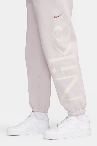 Nike Pantaloni de trening conici cu buzunare oblice Femei