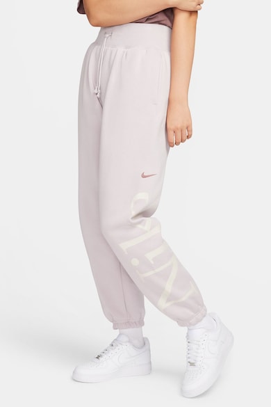 Nike Pantaloni de trening conici cu buzunare oblice Femei