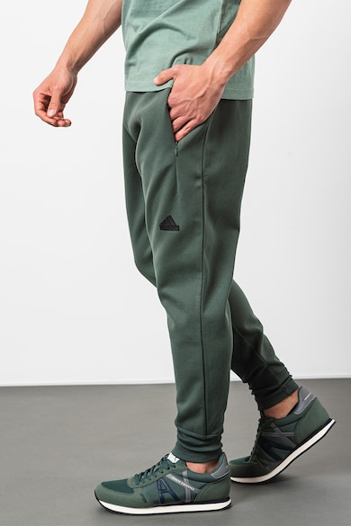 adidas Sportswear Pantaloni de trening cu croiala conica si buzunare laterale M Z.N.E Barbati