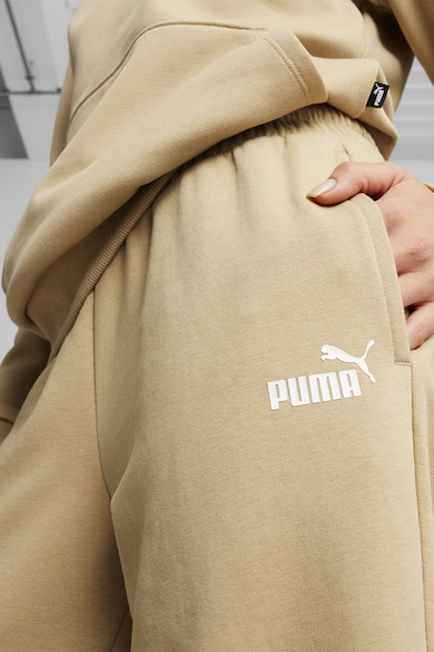 Puma Pantaloni de trening relaxed fit cu logo Essetials+ Femei