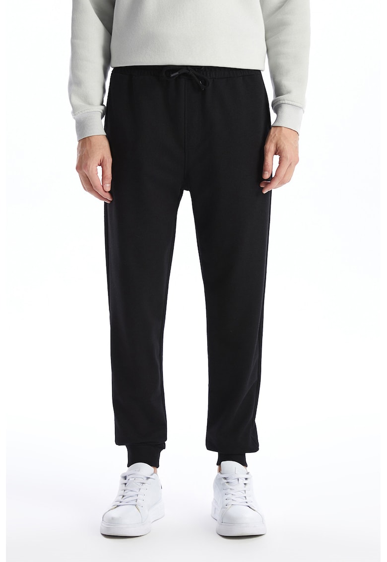 Pantaloni de trening uni cu terminatii elastice Pantaloni de trening uni cu terminatii elastice