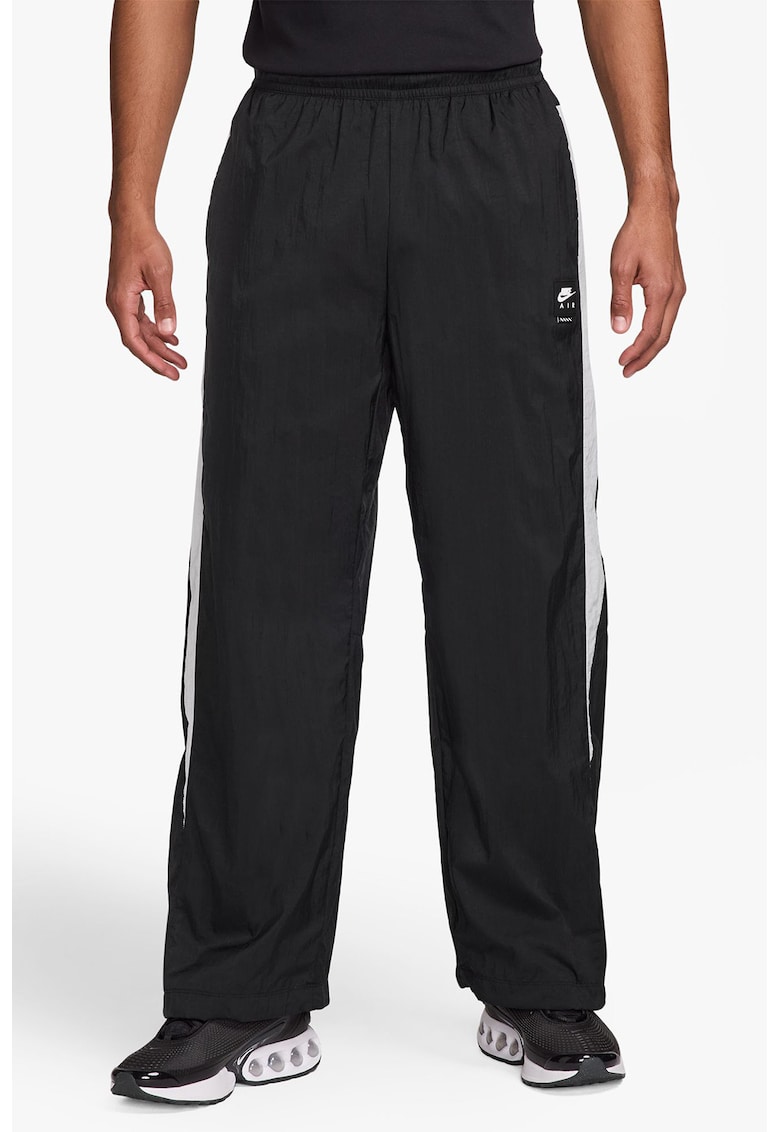 Pantaloni de trening cu buzunare cu fermoar si snururi la terminatie