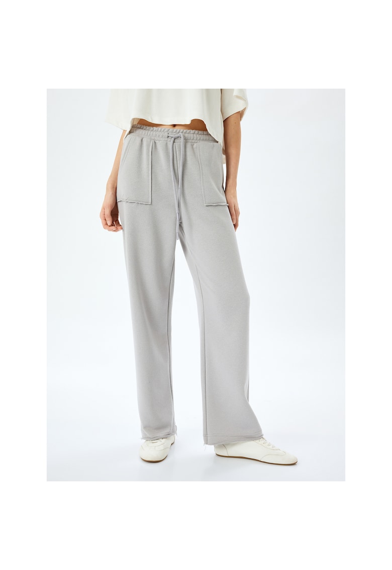 Pantaloni relaxed fit de trening cu buzunare aplicate Pantaloni relaxed fit de trening cu buzunare aplicate