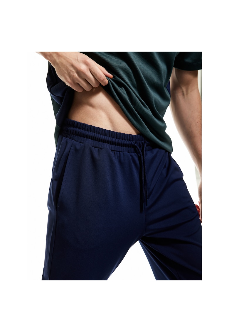 Pantaloni conici de trneing cu buzunare laterale - Bleumarin