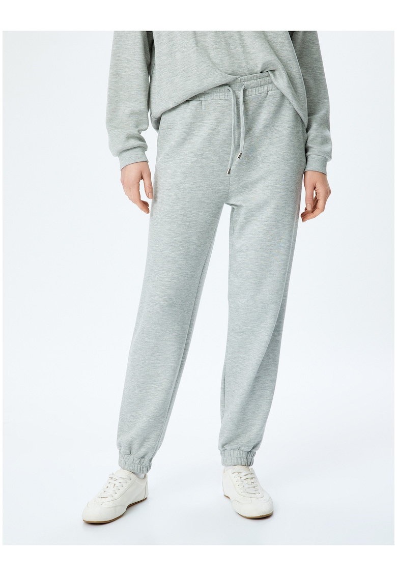 Pantaloni conici de trening cu snur