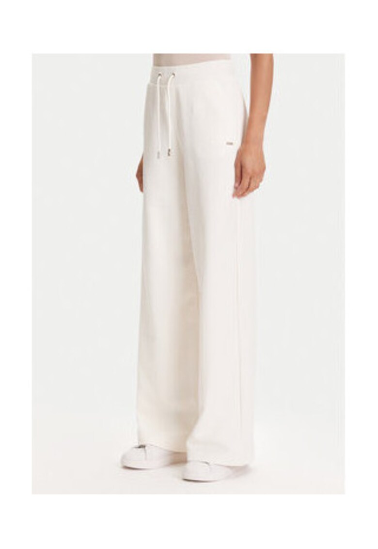 Pantaloni de trening din amestec de bumbac cu snur in talie si croiala evazata