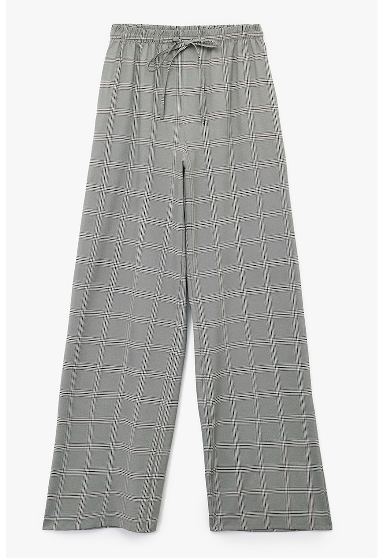 Pantaloni cu croiala ampla si model in carouri