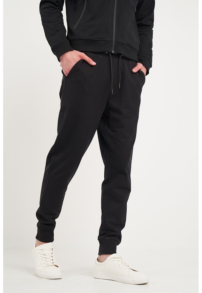 Pantaloni conici uni de trening