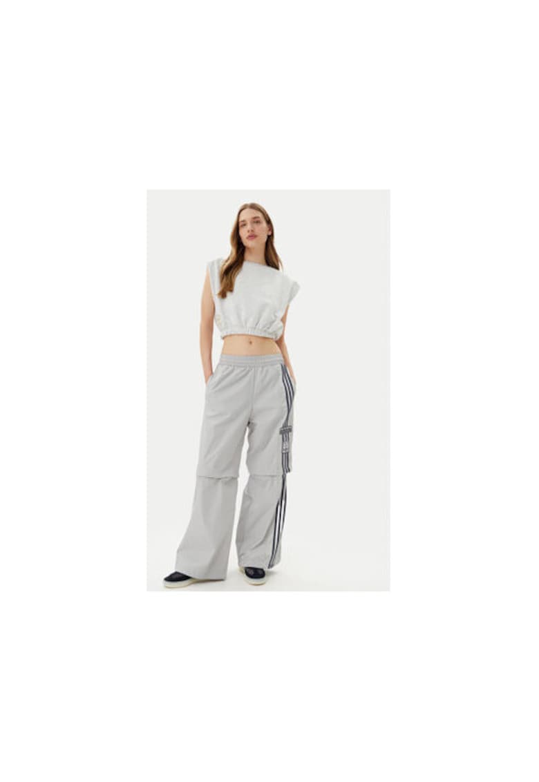 Pantaloni ampli cu buzunare laterale