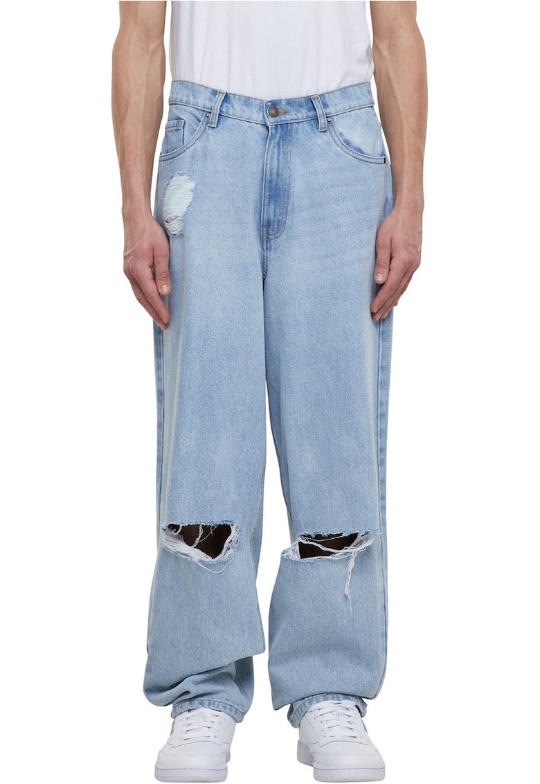 Blugi ampli cu rupturi decorative