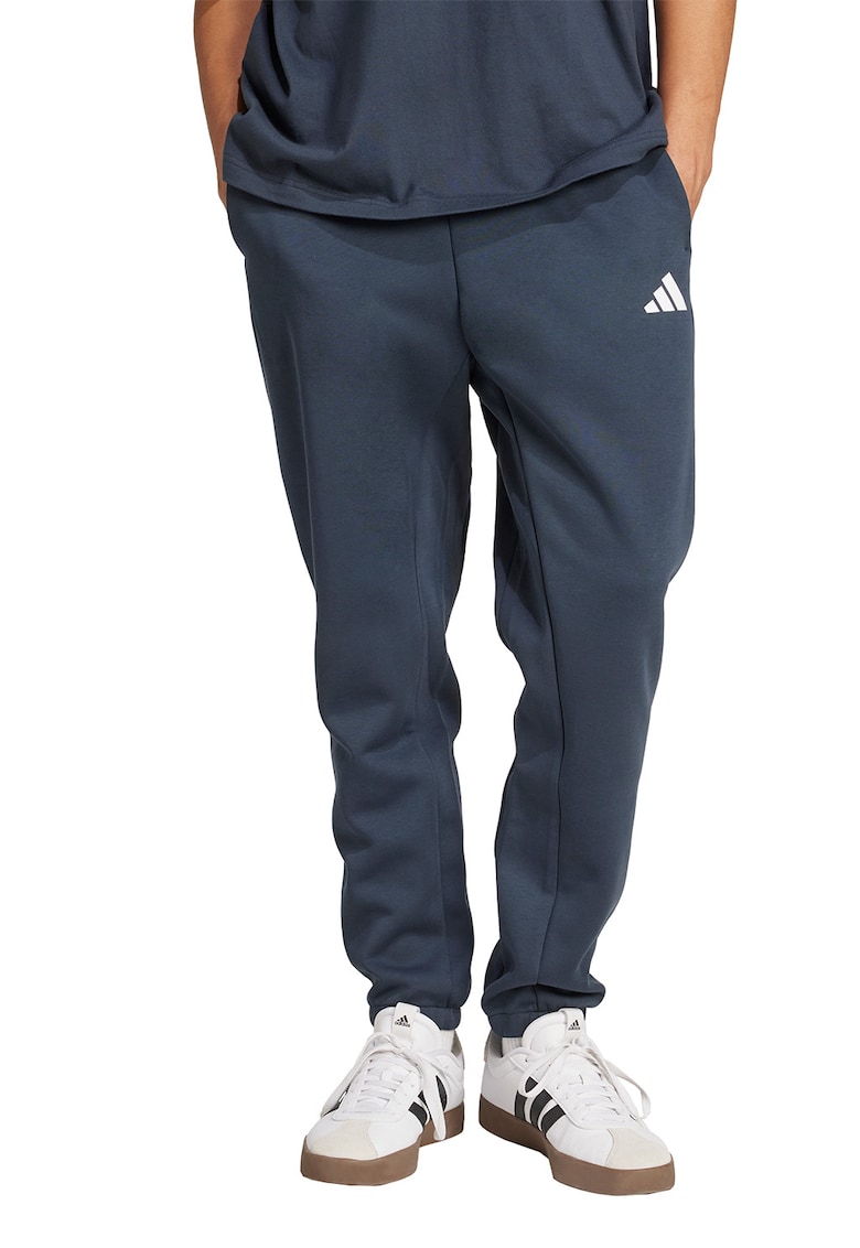 Pantaloni de trening conici cu buzunare laterale