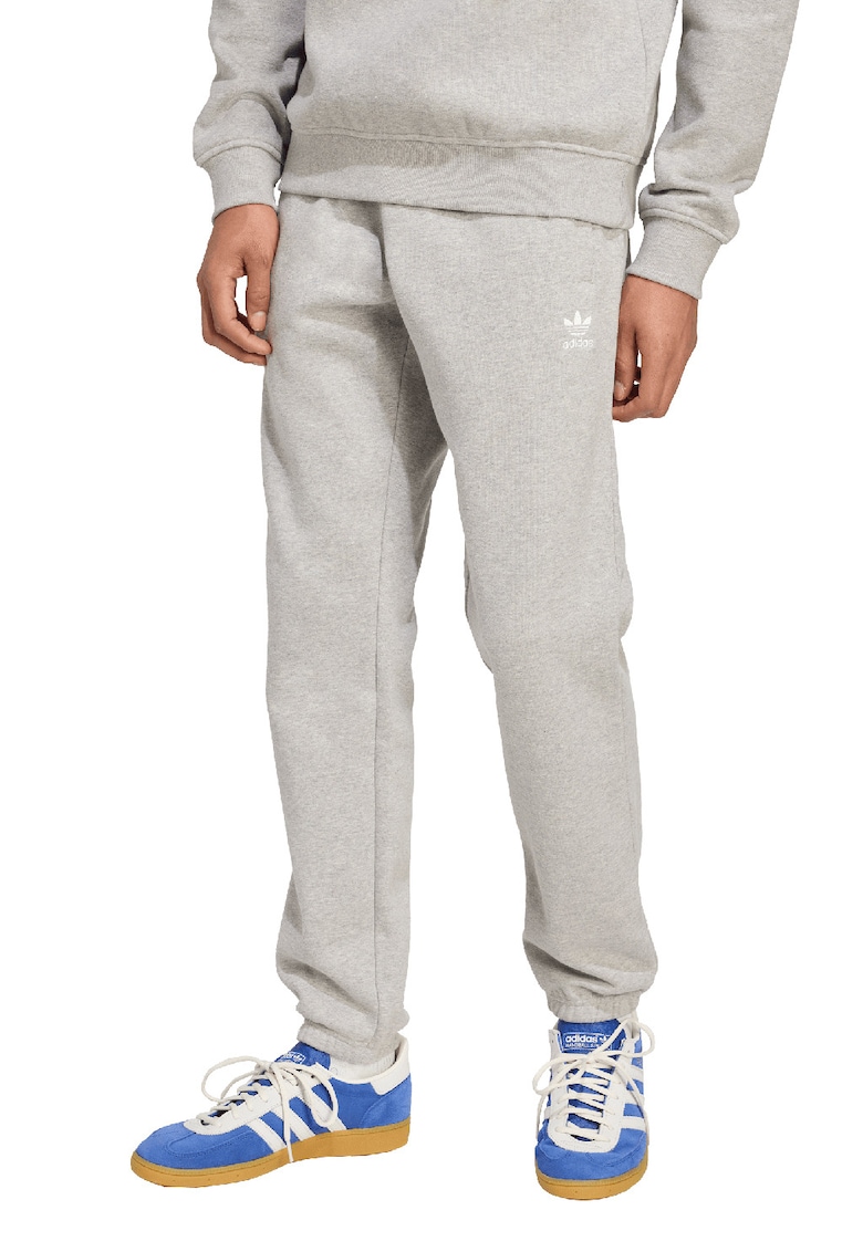 Pantaloni de trening cu croiala conica si banda elastica in talie