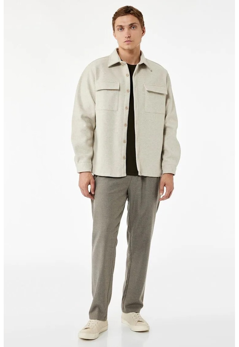 Pantaloni conici cu model uni