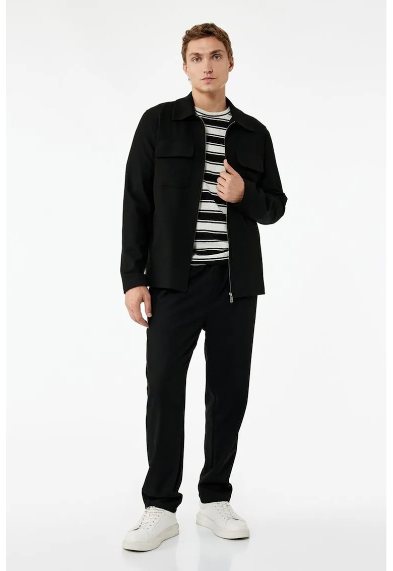 Pantaloni conici cu model uni