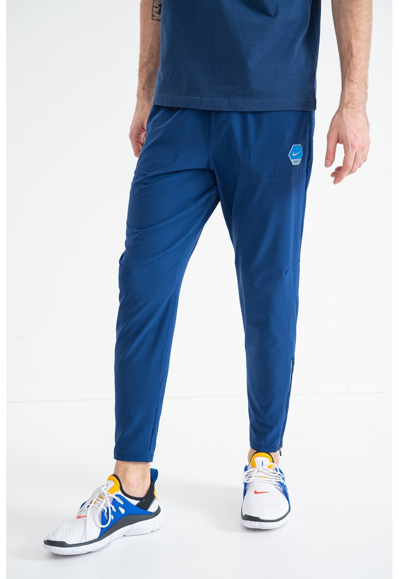 Pantaloni conici de trening cu logo - Albastru inchis