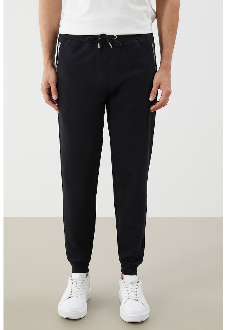 Pantaloni conici de trening cu snur in talie