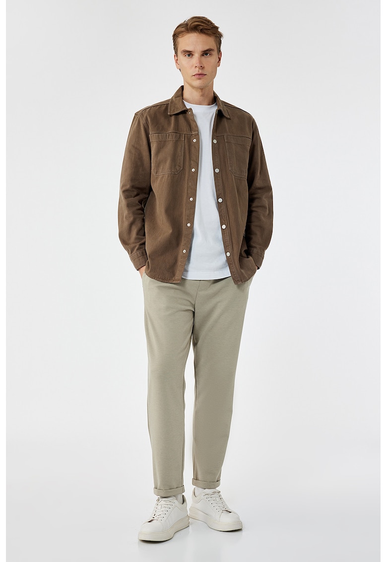 Pantaloni conici cu model uni