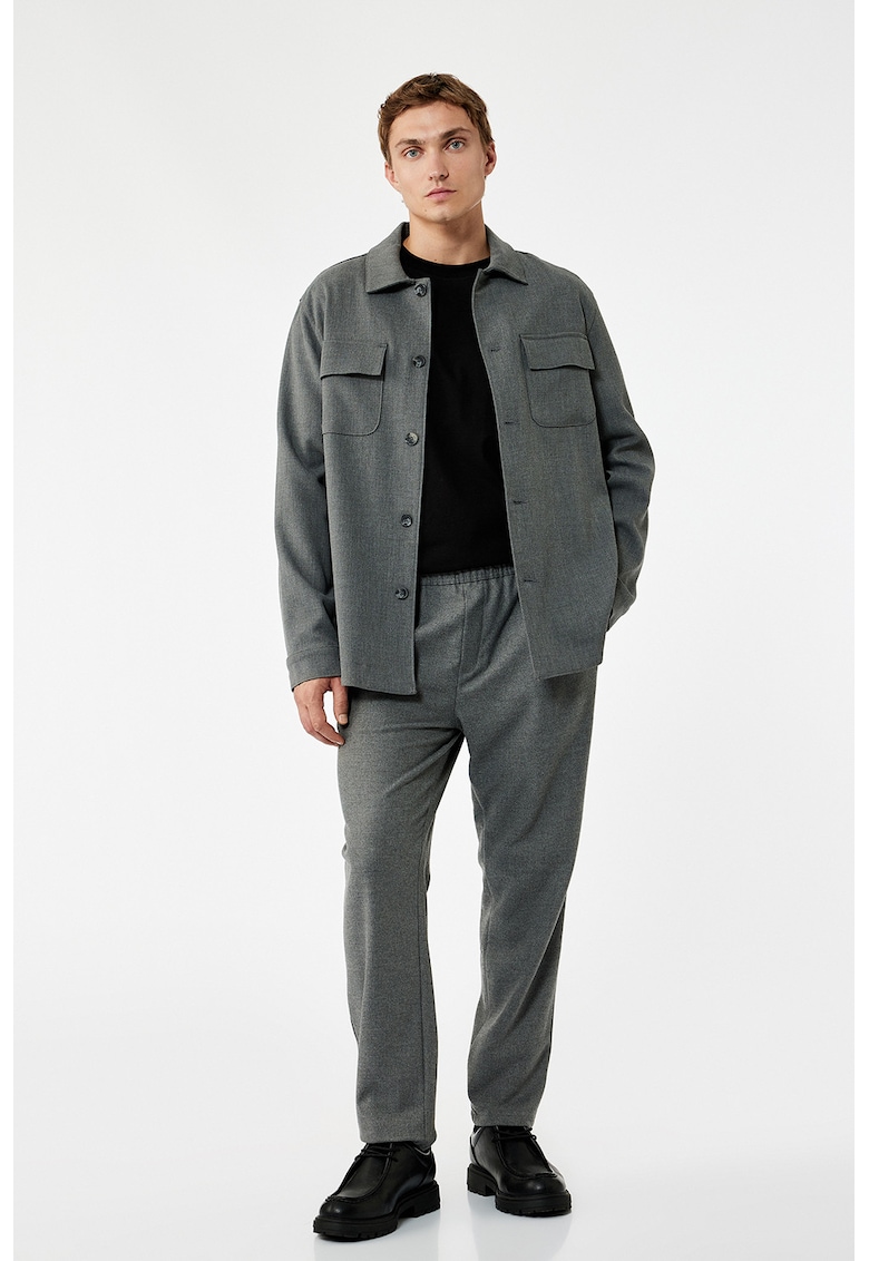 Pantaloni conici cu model uni