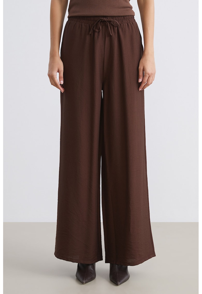 Pantaloni evazati cu buzunare laterale