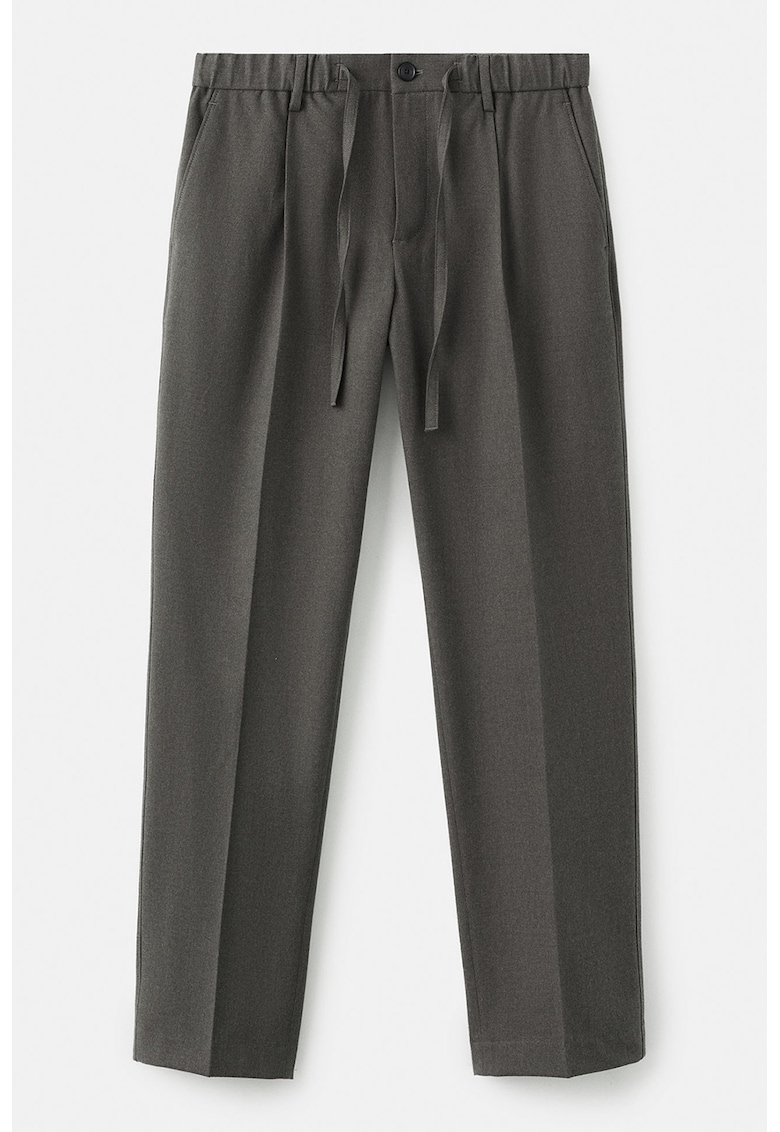 Pantaloni conici cu buzunare laterale si model uni