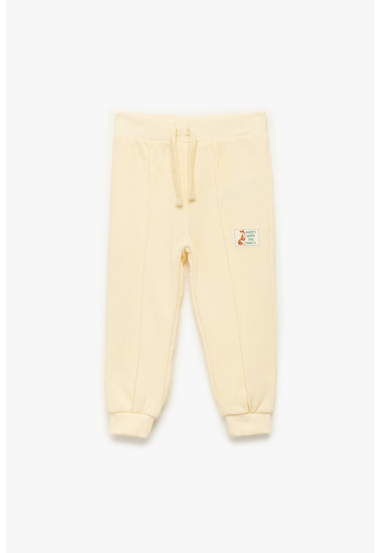 Pantaloni din bumbac cu detaliu aplicat - Galben pal