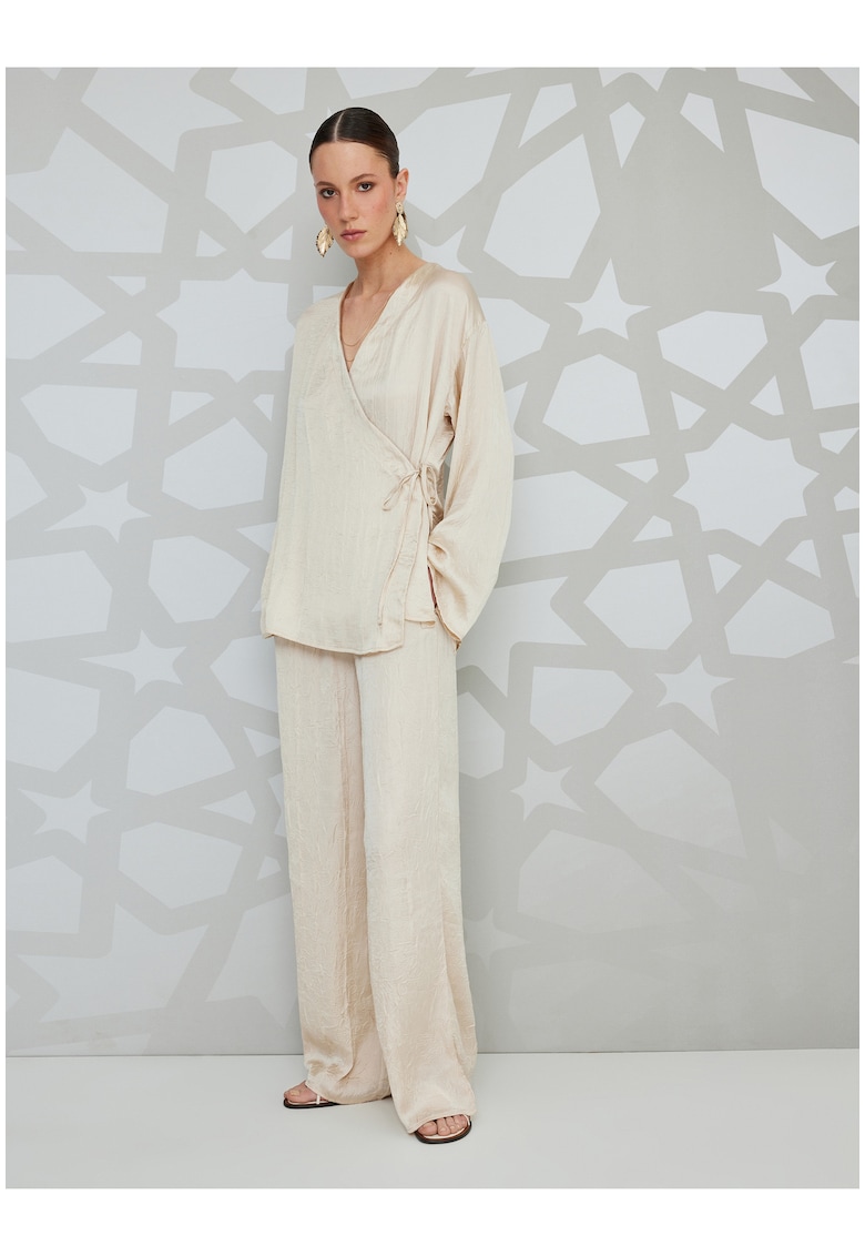 Pantaloni cu croiala ampla si aspect texturat