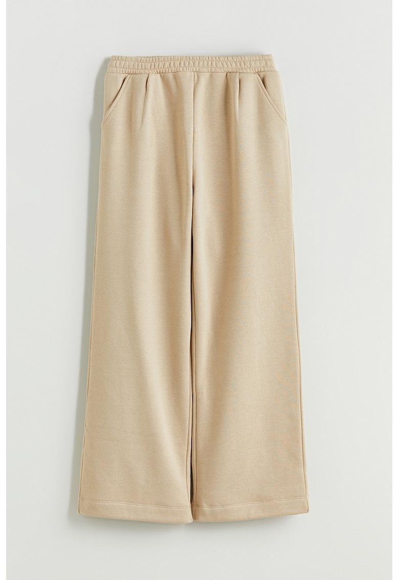 Pantaloni cu buzunare laterale si croiala ampla