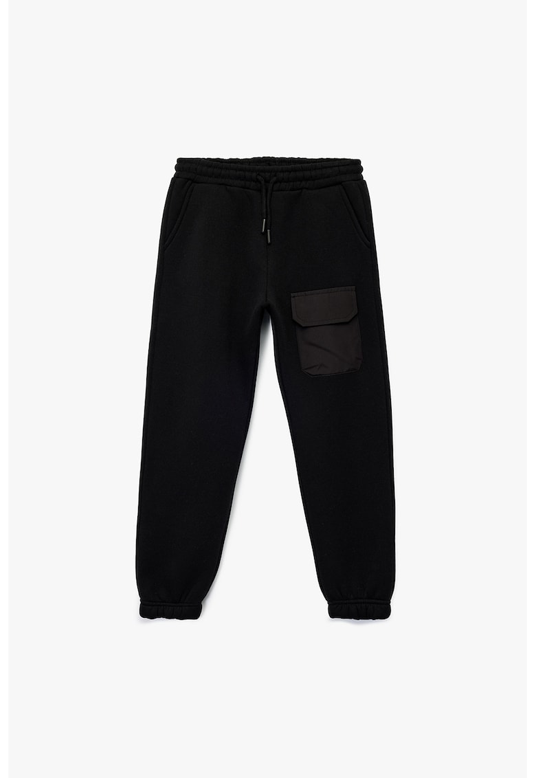 Pantaloni conici de trening