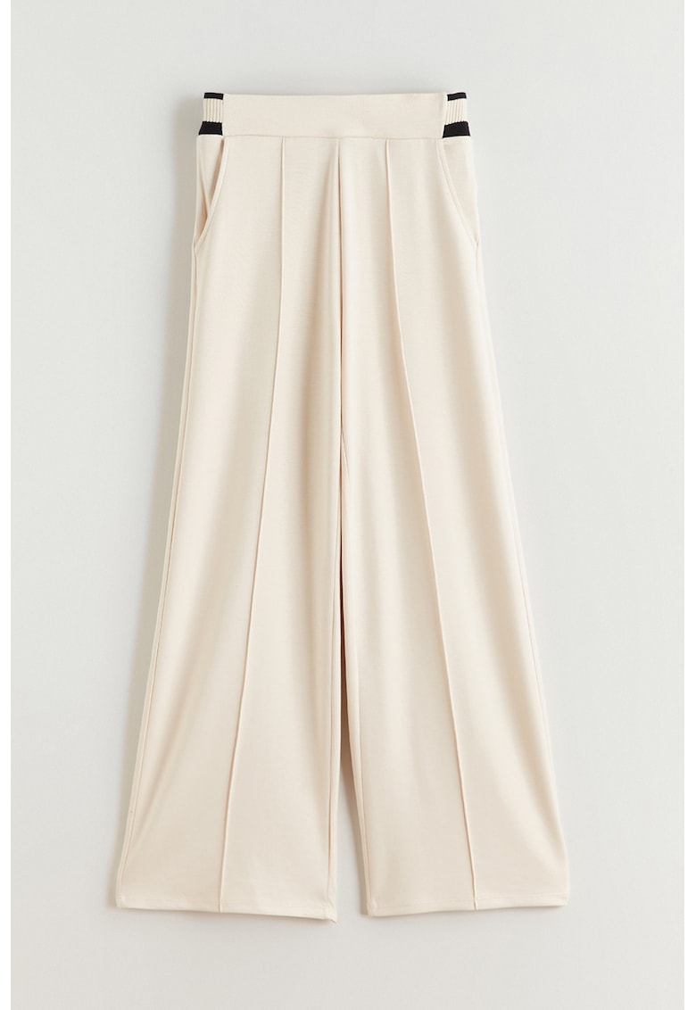 Pantaloni cu croiala ampla si buzunare laterale - Bej deschis