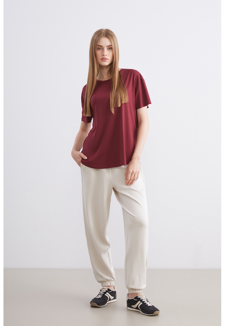 Pantaloni de trening cu buzunare laterale si talie elastica - Alb fildes