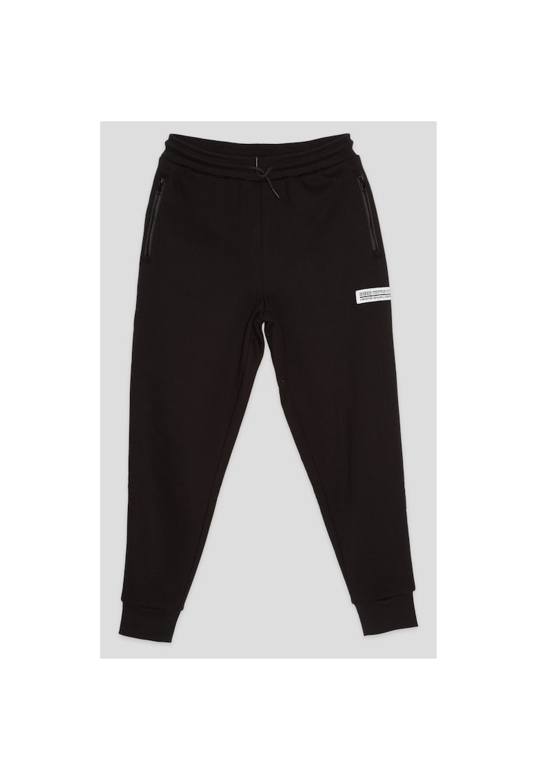 Pantaloni de trening conici cu buzunare cu fermoar -