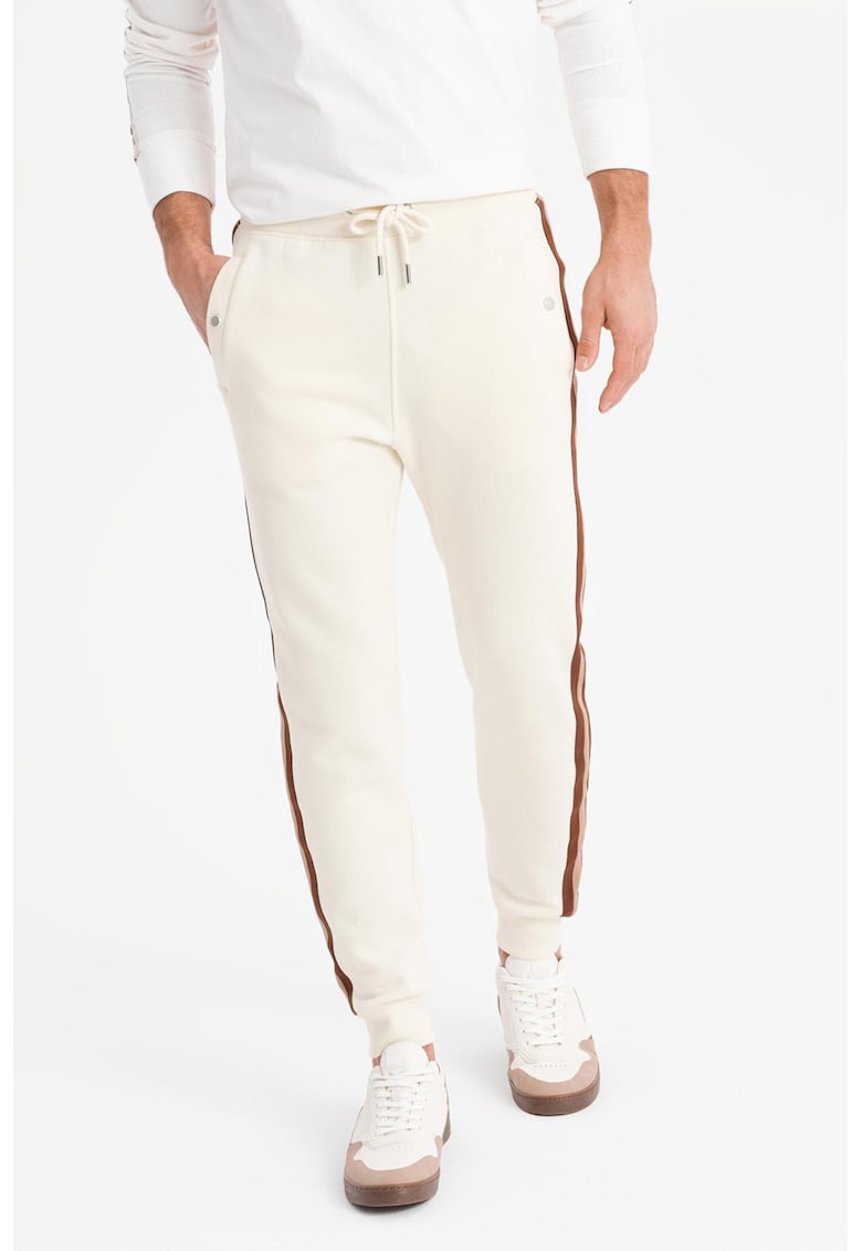 Pantaloni de trening cu croiala conica si segmente laterale contrastante