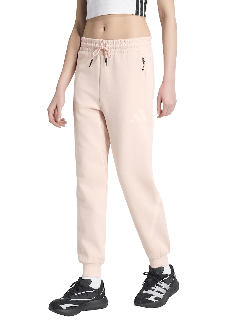 Pantaloni de trening cu buzunare cu fermoar Z.N.E. - Piersica