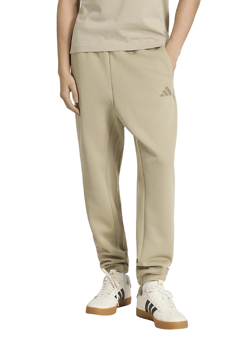 Pantaloni de trening conici cu buzunare laterale - Bej