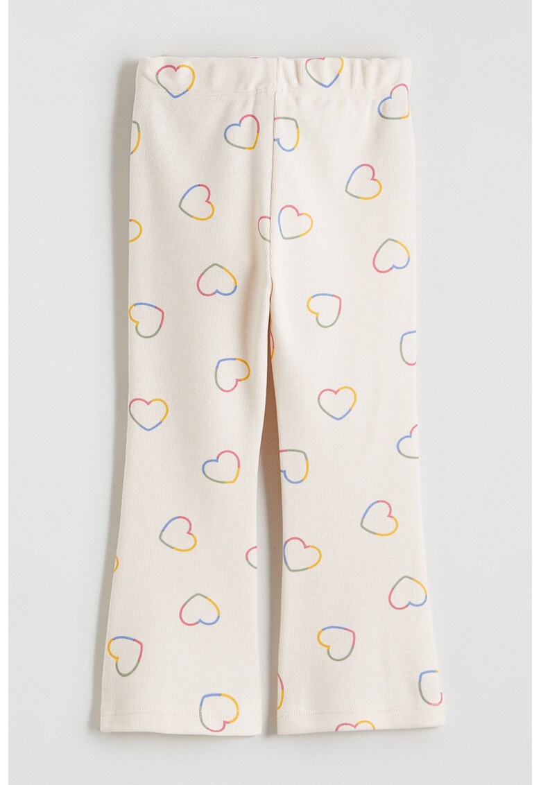Pantaloni slim fit evazati cu model cu inimi - Crem