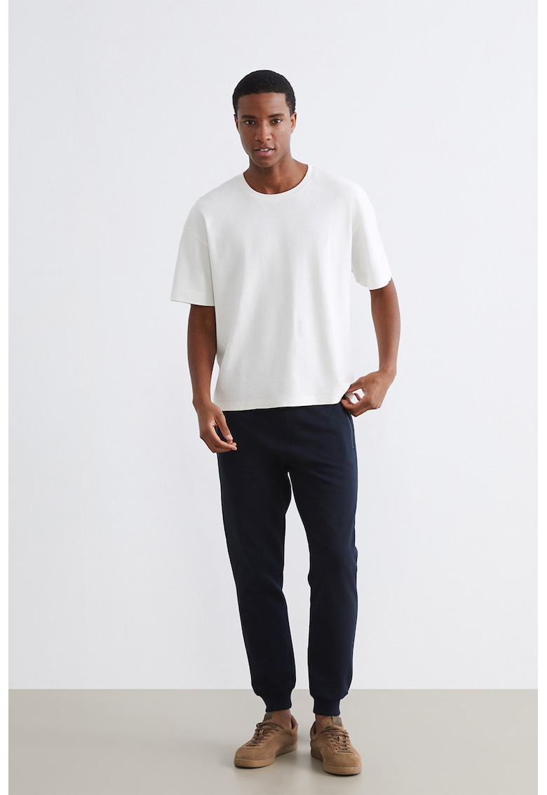 Pantaloni de trening cu croiala conica - snur de ajustare si buzunare cu fermoar - Albastru ultramarin