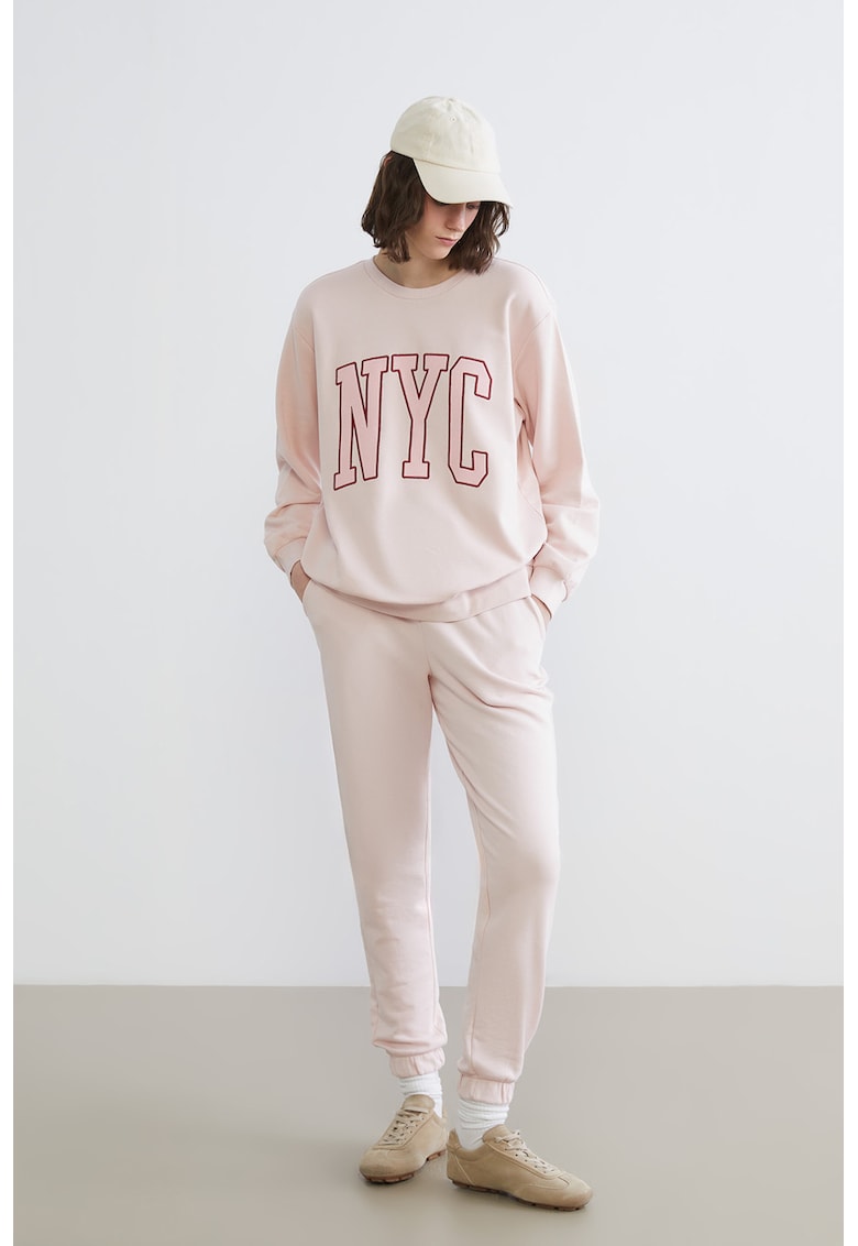 Pantaloni de trening cu croiala conica si snur - Nude rose