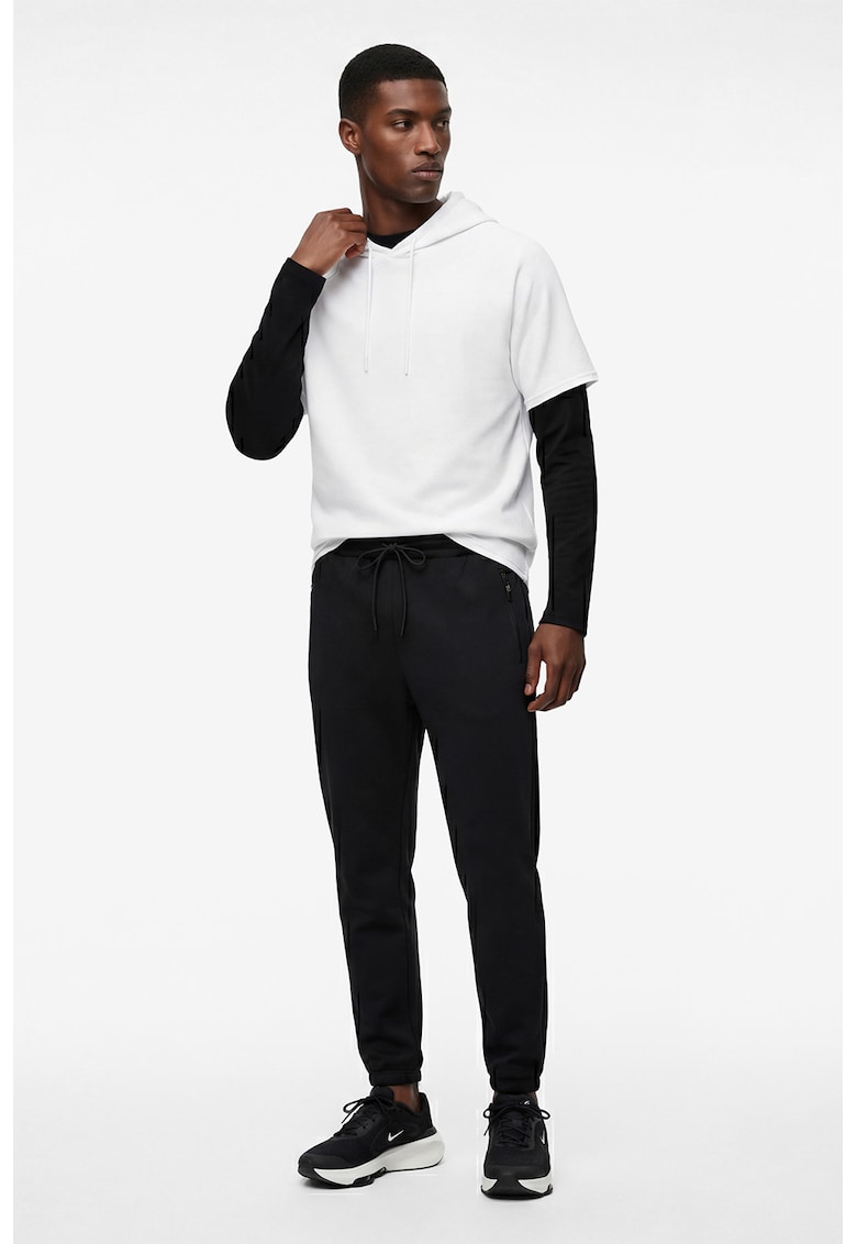 Pantaloni de trening cu buzunare cu fermoar - Negru