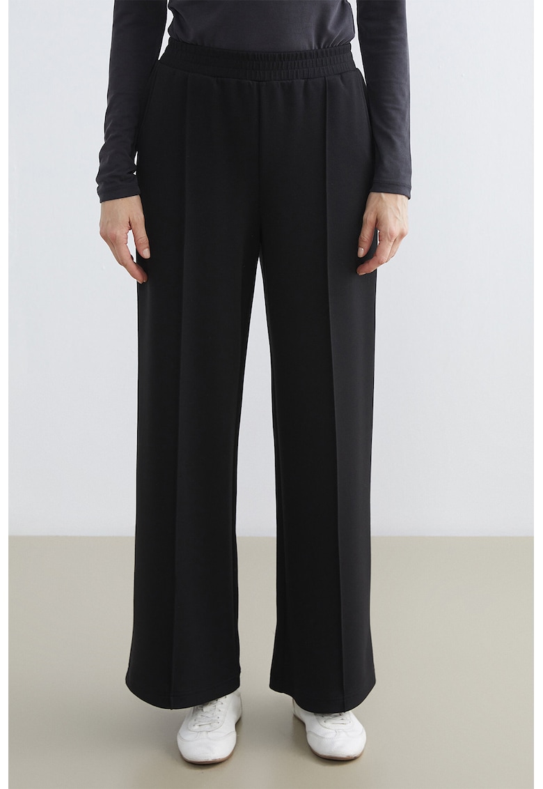 Pantaloni de trening cu croiala evazata si model uni - Negru