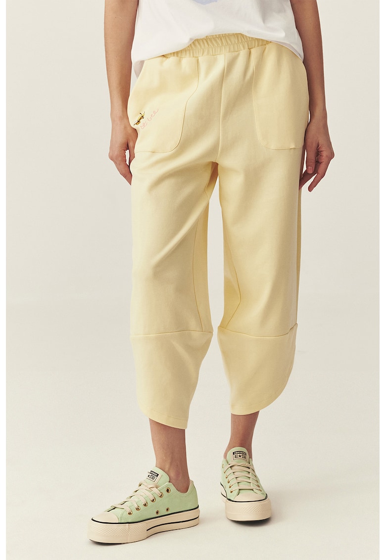 Pantaloni asimetrici de trening cu imprimeu Maya The Bee - Galben pastel