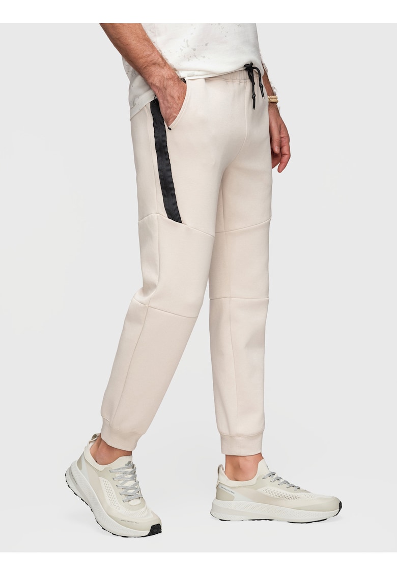 Pantaloni jogger cu elastic si buzunare laterale - Bej nisip