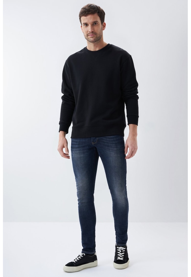 Blugi skinny cu talie joasa.
