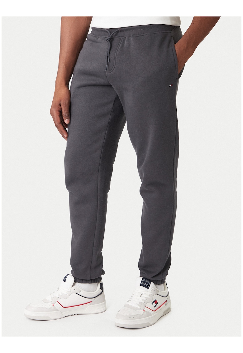 Pantaloni de trening cu model uni si buzunare laterale